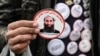 A man sells stickers with a picture of Taliban supreme leader Mullah Haibatullah Akhundzada at a market in Kabul. (file photo)