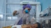 A nurse takes care of a baby in the neonatal intensive care unit at the Malalai Maternity hospital in Kabul.