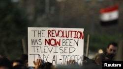 Antigovernment protesters outside the Egyptian television center in Cairo on February 11