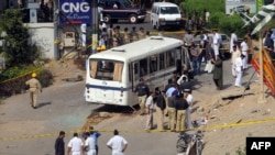 Navy investigators have been looking into the bus bombing in Karachi which reportedly killed five people.