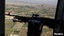 A Taliban spokesman claimed the helicopter was shot down by rocket fire and burst into flames.