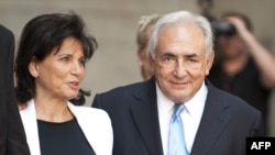 Former International Monetary Fund chief Dominique Strauss-Kahn (right) and his wife Anne Sinclair leave a New York court on July 1.