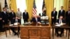 U.S. President Donald Trump (center) speaks before Kosovar Prime Minister Avdullah Hoti (right) and Serbian President Aleksandar Vucic sign an agreement on opening economic relations, in the Oval Office at the White House on September 4.