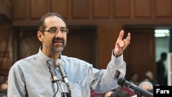 Iranian-American scholar Kian Tajbakhsh taestifies at his trial in August.