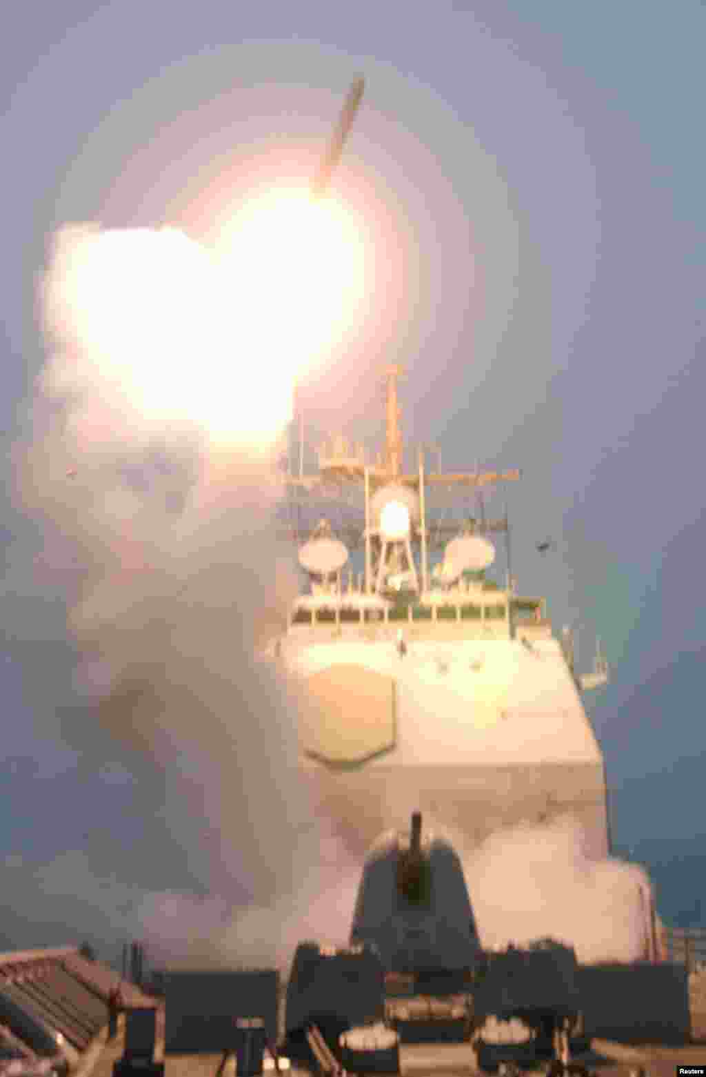 The first Tomahawk missile to be fired into Iraq is launched from the USS Bunker Hill in the Persian Gulf early on March 20, 2003.