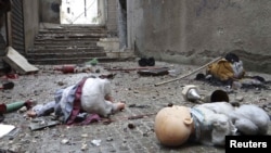 Toys are seen among the rubble of damaged shops in the war-ravaged Syrian city of Aleppo.