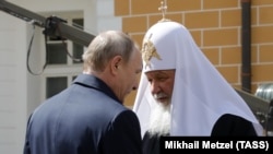 Russia's President Vladimir Putin (left) and Patriarch Kirill (file photo)