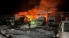 A police officer walks at the site of a warehouse hit by a Russian drone strike in Sumy, Ukraine, on March 6.