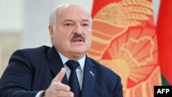 (FILES) Belarus' President Alexander Lukashenko speaks as he meets with foreign media at his residence, the Independence Palace, in the capital Minsk on February 16, 2023.