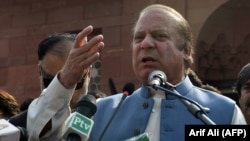 Former Pakistani Prime Minister Nawaz Sharif speaks to reporters at the tomb of national poet Allama Mohammad Iqbal to mark the country's Independence Day in Lahore last month.