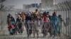 Afghans arriving in Pakistan through the border crossing in Chaman.