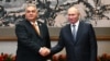 Russian President Vladimir Putin (right) and Hungarian Prime Minister Viktor Orban shake hands at a meeting in Beijing earlier this month. 