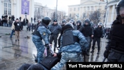 Riot police clash with football fans in central Moscow on December 11.