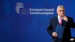 Hungarian Prime Minister Viktor Orban arrives for an EU summit at the European Council building in Brussels on December 14. 