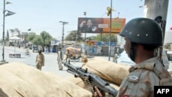 A Pakistani soldier stands guard in a bunker in Quetta. Is the city the next front in the war on the Taliban?