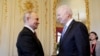 Russian President Vladimir Putin (left) and U.S. President Joe Biden shake hands as they meet for talks in Geneva on June 16. 