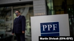 A security officer stands guard outside PPF Group's headquarters in Prague.