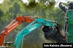 A Soviet military monument is dismantled in Riga in August 2022.