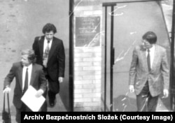 Anti-communist dissident Vaclav Havel (front left) seen leaving the Canadian Embassy with his brother Ivan, who wears a patterned tie.