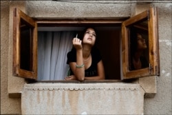 A woman smoking a cigarette in central Bukhara in 2010