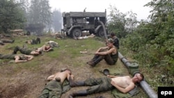 Servicemen taking part in fighting forest and peat fires rest in a forest near the town of Gus-Khrustalny in Russia's Vladimir region on August 2.