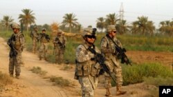 U.S. Army soldiers spread out during an operation to disrupt weapons smuggling north of Baghdad on August 8.