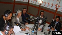 Guests take part in a discussion on "On The Waves of Freedom" in Radio Azadi's studio in Kabul.