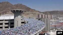 Muslim pilgrims arrive to throw pebbles at pillars during the stoning of Satan ritual in Mina near the holy city of Mecca.