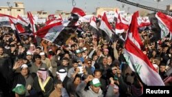 Sunni Muslims take part in an antigovernment demonstration at the Sunni Umm Al-Qura Mosque in Baghdad on January 11.