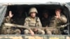 Ethnic Armenian Karabakh troops in the back of a truck on the way to the town of Martakert, Nagorno-Karabakh, in the midst of clashes with Azerbaijan on September 29.