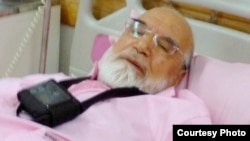 A photo released by Mehdi Karrubi's son on Twitter shows him in a hospital in Tehran in July.