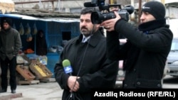 Sahar TV correspondent Anar Bayramli (left) had a year cut from his sentence.