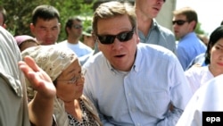 German Foreign Minister Guido Westerwelle visits a neighbourhood hit by ethnic unrest in Osh on July 16.