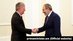 Armenia's acting Prime Minister Nikol Pashinian (right) meets U.S. national-security adviser John Bolton in Yerevan on October 25.