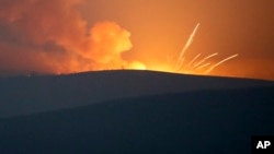 Explosions in the mountains during fighting between Armenian and Azerbaijani forces outside Stepanakert, in the breakaway region of Nagorno-Karabakh.