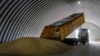 A dump truck unloads grain in a granary in the village of Zghurivka, Ukraine.