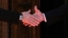 Russian President Vladimir Putin (left) shakes hands with U.S. President Joe Biden during their meeting in Geneva on June 16.