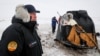 Roskosmos chief Dmitry Rogozin stands near a Soyuz capsule shortly after its landing in a remote area near the Kazakh town of Zhezkazgan in December 2018.