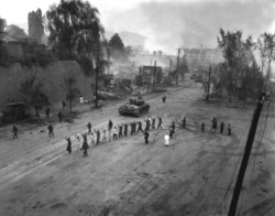 Prisoners rounded up near a U.S. tank on September 26, 1950.