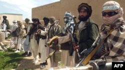 Taliban fighters pose for a picture at a mosque in Ghazni Province in April.