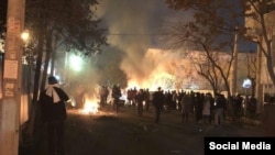 Iranian police and security forces clash with members of a Sufi Muslim religious community in Tehran late on February 19.