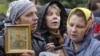 Russian Orthodox believers gather outside a court building during the trial of members of the female punk collective "Pussy Riot" for hooliganism motivated by religious hatred earlier this year. 