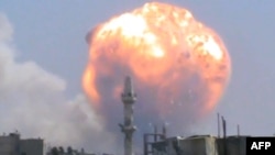 An image grab taken from a video uploaded on YouTube appears to show the explosion at the Homs ammo depot.