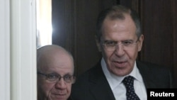 Russian Foreign Minister Sergei Lavrov (right) with his Algerian counterpart, Mourad Medelci, in Moscow on December 13