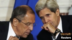 U.S. Secretary of State John Kerry (right) and Russian Foreign Minister Sergei Lavrov confer at the State Department on August 9.