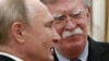 Russian President Vladimir Putin (left) attends a meeting with U.S. national-security adviser John Bolton at the Kremlin on October 23.