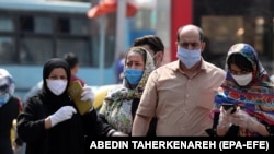 Iranians shop near Tehran's grand bazaar July 7.