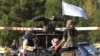 Taliban fighters patrol a street in Kabul on August 27.