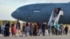 Afghans disembark from a U.S. Air Force aircraft after an evacuation flight from Kabul in Rota in southern Spain on August 31, 2021.