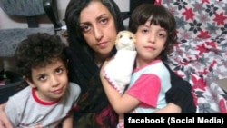 Iranian human rights activist, Narges Mohammadi with her children Ali (center) and Kiana